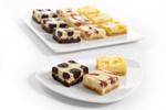 Three trays of mini cheesecakes; lemon, strawberry and chocolate: pre-cut, 240 portions