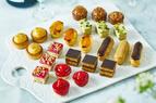 A colourful selection with Lemon Tartlet, Opera Square, Raspberry Financier, Pistachio Rectangle, Coffee & Chocolate Eclairs, Apple & Blackcurrant Square, Apricot Flan & Chocolate Tartlet