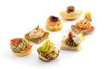 7 varieties: Polenta Base with Courgette and Cherry Tomato x9, Horseradish Cheese and Paprika on Sandwich Bread with Spinach x9, Choux Pastries with Goat’s Cheese, Almonds and Pistachios x9, Aubergine Preparation Ewe’s Cheese and Almonds on Sandwich Bread