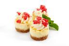 A biscuit base topped with raspberry & rosewater flavour jam, vanilla flavour cheesecake & finished with a cream swirl sprinkled with pink macaroon pieces; individual, 24 portions